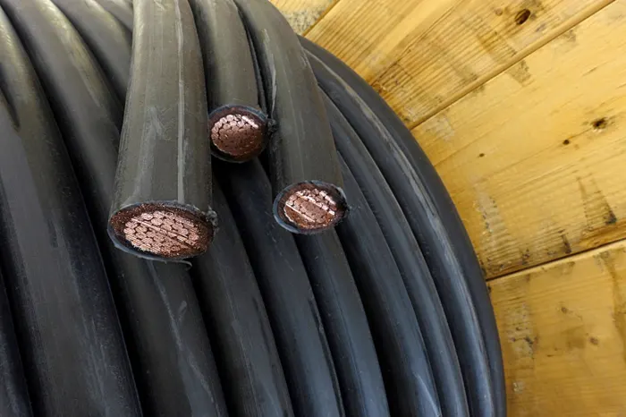 Coiled power cables with copper conductors